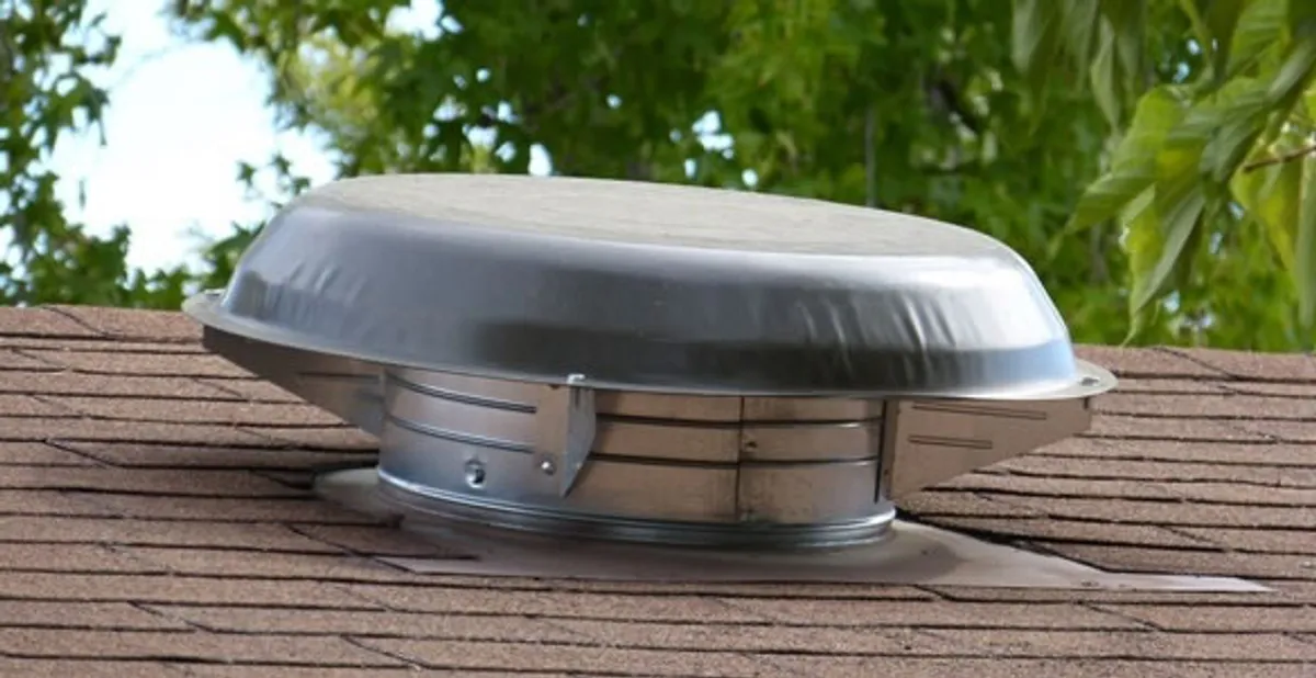 attic fan installation services with low-profile roof ventilation unit in Clearwater, FL