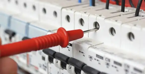 Electrical contractor testing circuit breakers during electrical repair in Seminole, FL