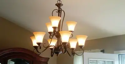 Classic ceiling chandelier installation with warm lighting in Clearwater, FL