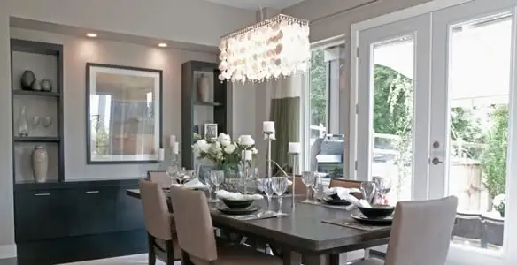 Elegant dining room chandelier installation above table in Clearwater, FL