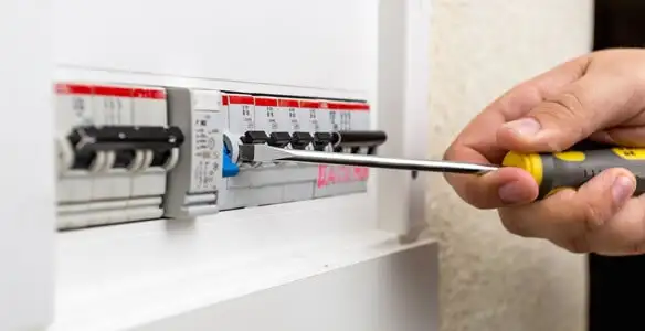 electrical panel upgrade service showing technician adjusting circuit breakers during system upgrade in Clearwater, FL