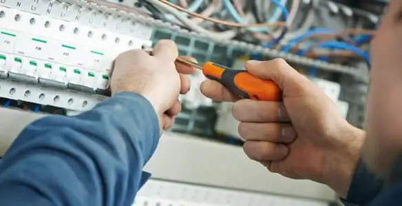 electrical service showing licensed electrician performing electrical panel maintenance and adjustments in Clearwater, FL