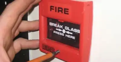 fire alarm installation service showing manual fire alarm pull station installed by licensed electricians in Clearwater, FL