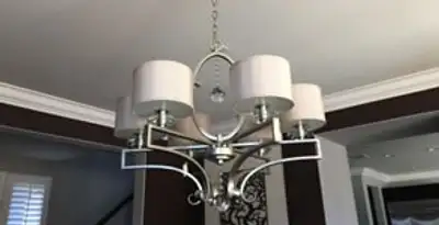 Modern chandelier installation with multiple light fixtures in Clearwater, FL