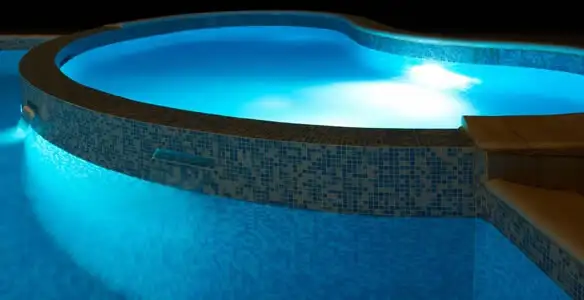 pool light installation and repair services highlighting illuminated pool interior lighting in Clearwater, FL