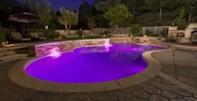 pool light installation and repair services illuminating a residential swimming pool in Clearwater, FL
