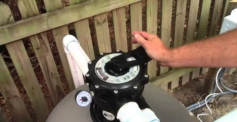 pool pumps service showing professional adjustment of pool pump control system in Clearwater, FL