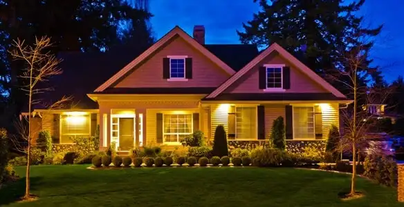 security light installation services illuminating a residential exterior at night in Clearwater, FL