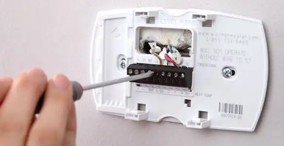 Thermostat installation service with proper wiring and secure wall mounting in Clearwater, FL