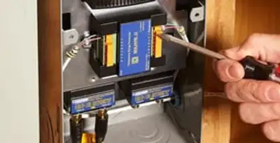 Whole home surge protection device being installed by a licensed electrician to protect electrical systems in Clearwater, FL